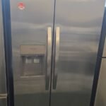 New Scratch and Dent Frigidaire 36-inch side-by-side refrigerator in a sleek stainless finish on display for the Appliance Worlds Clearance Sale.